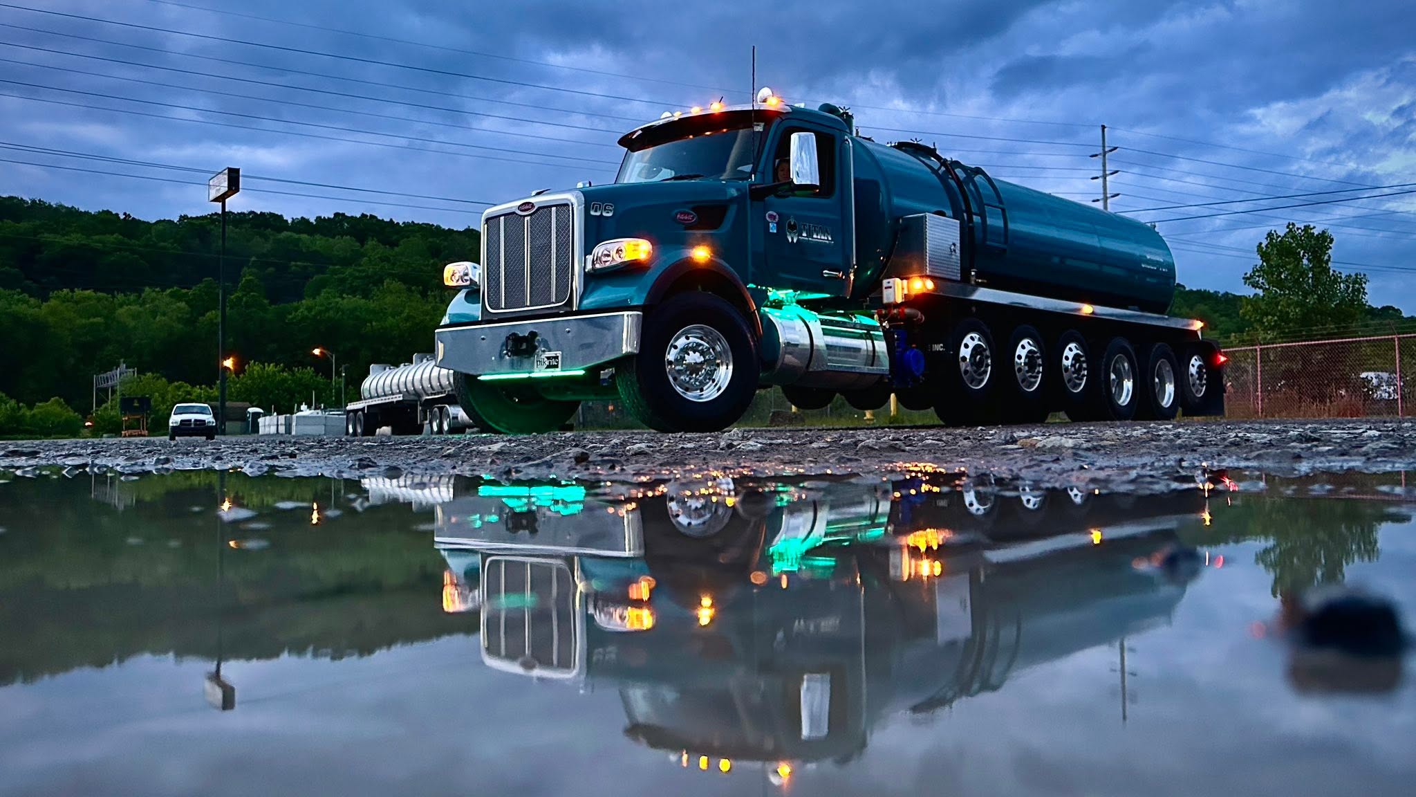 Titan water hauling truck at dusk